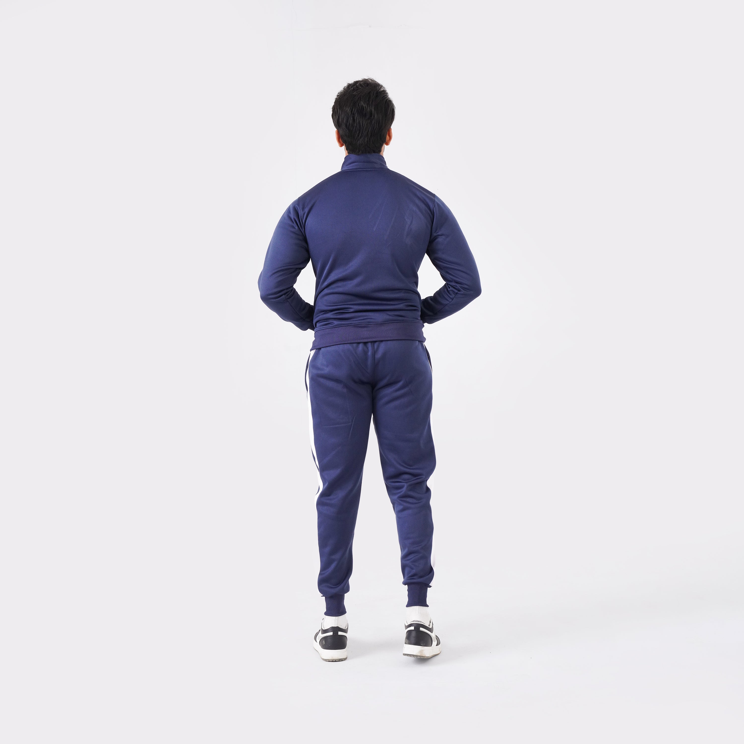 Men’s navy blue athletic tracksuit with side stripes for gym and casual style.