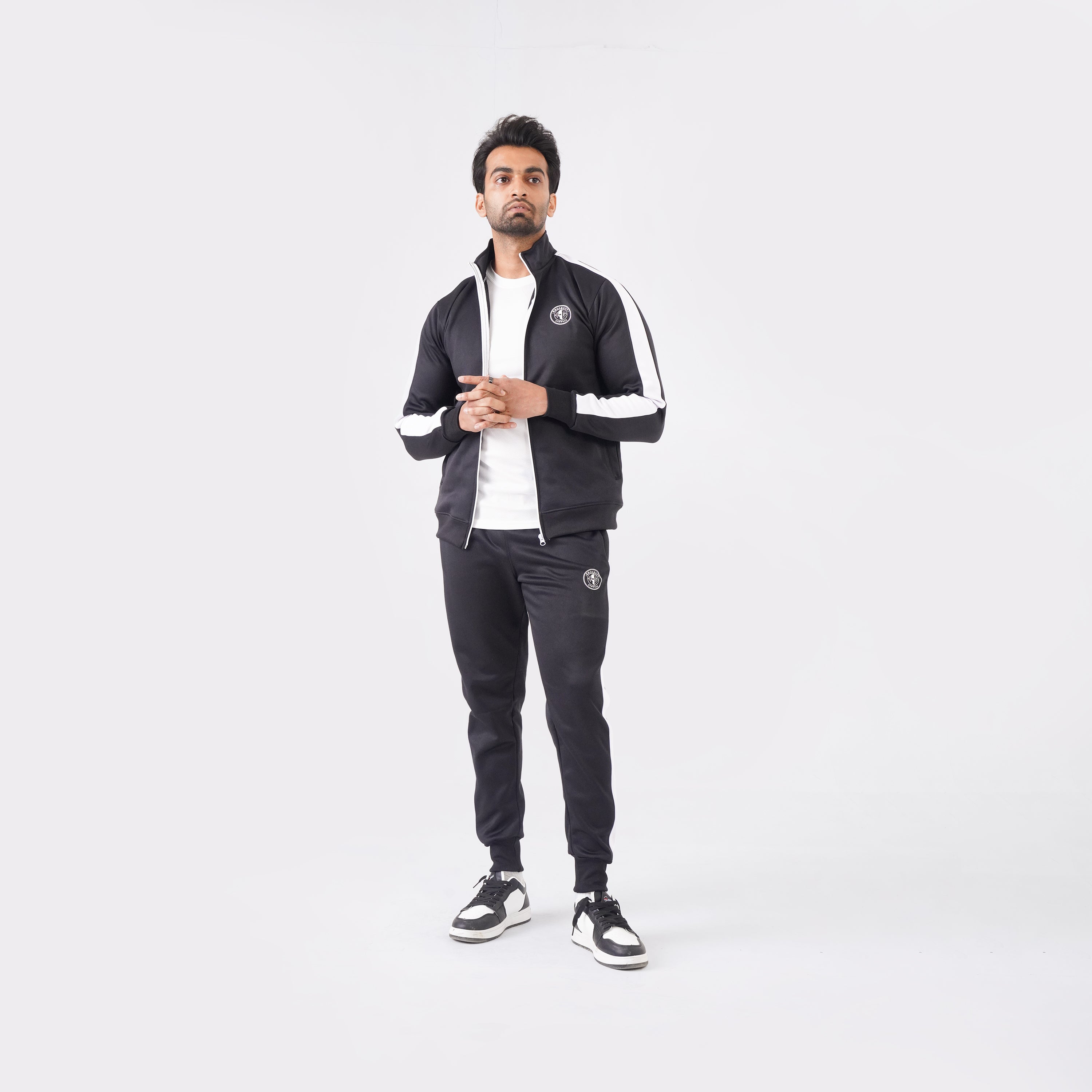 Men’s black athletic tracksuit with side stripes for gym and casual style.