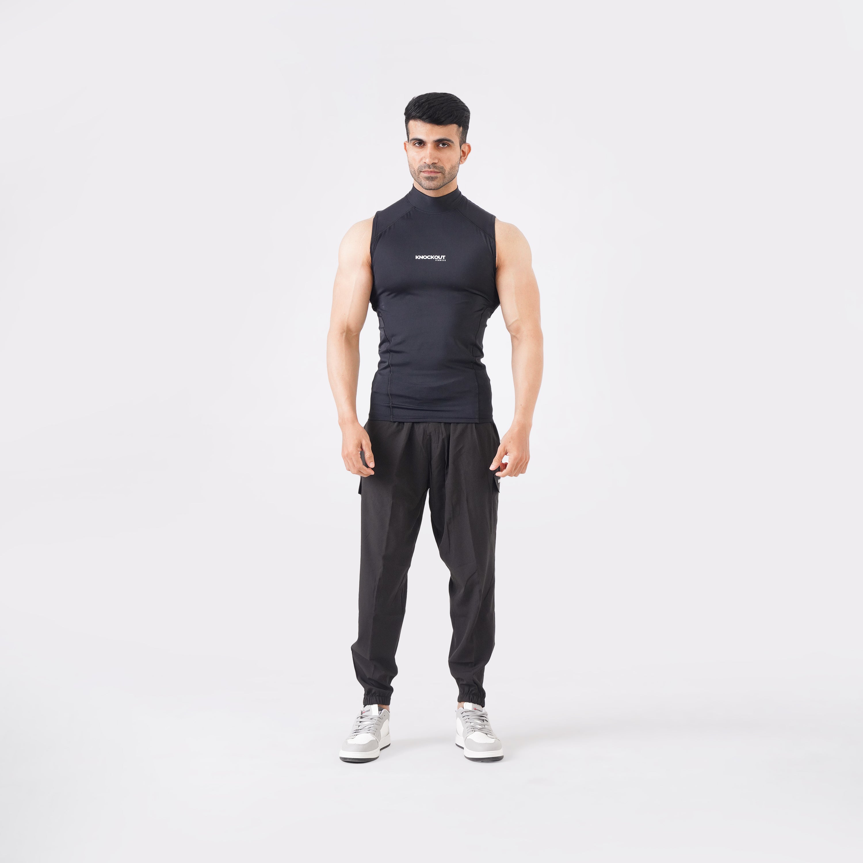 Black sleeveless high-neck compression shirt for men’s activewear.