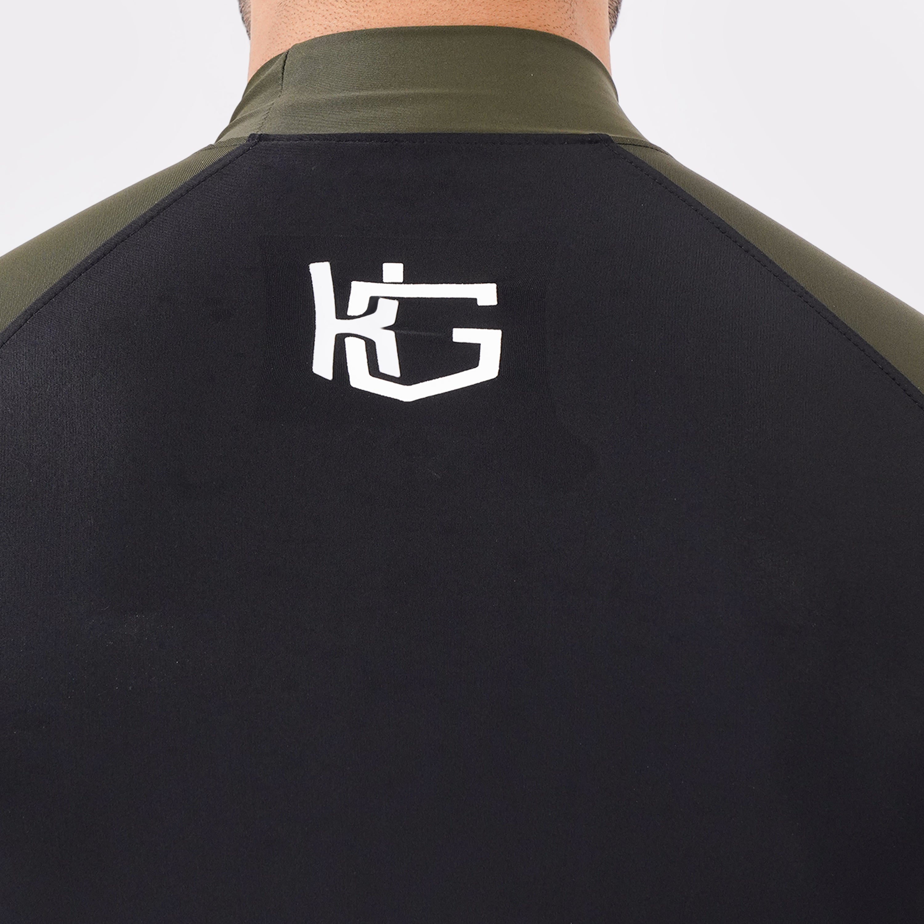 Knockout Black and Green high-neck compression shirt with front and back logo