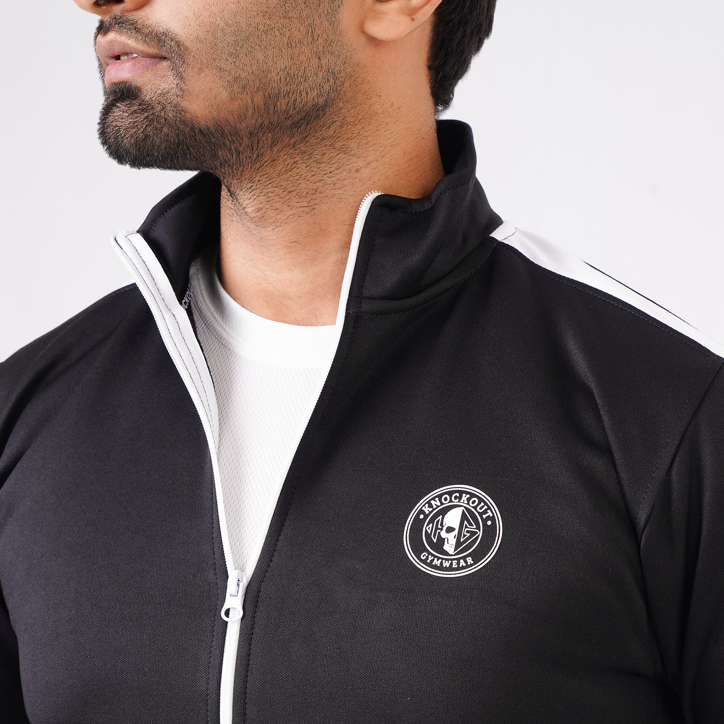 Men’s black athletic tracksuit with side stripes for gym and casual style.