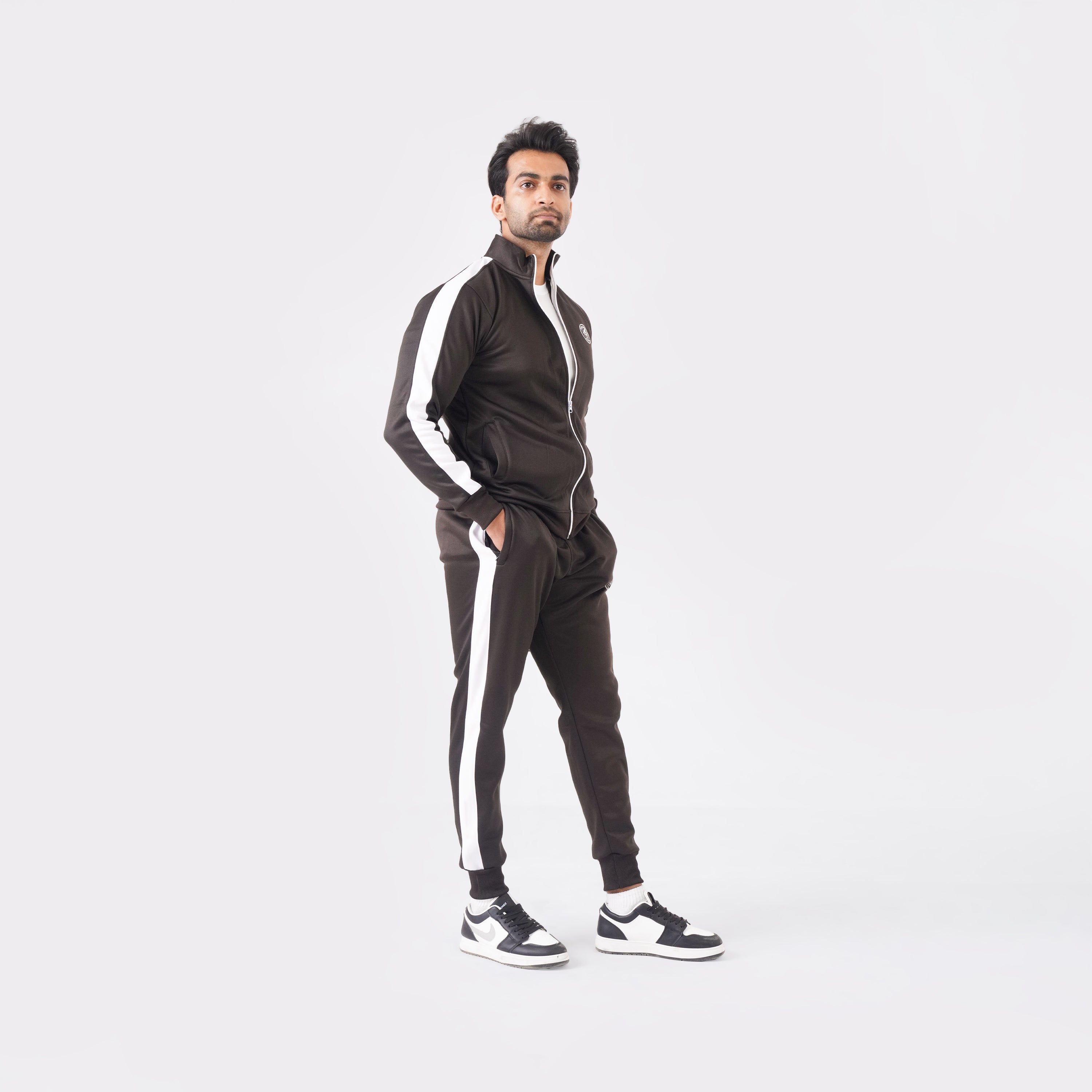 Men’s chocolate athletic tracksuit with side stripes for gym and casual style.

